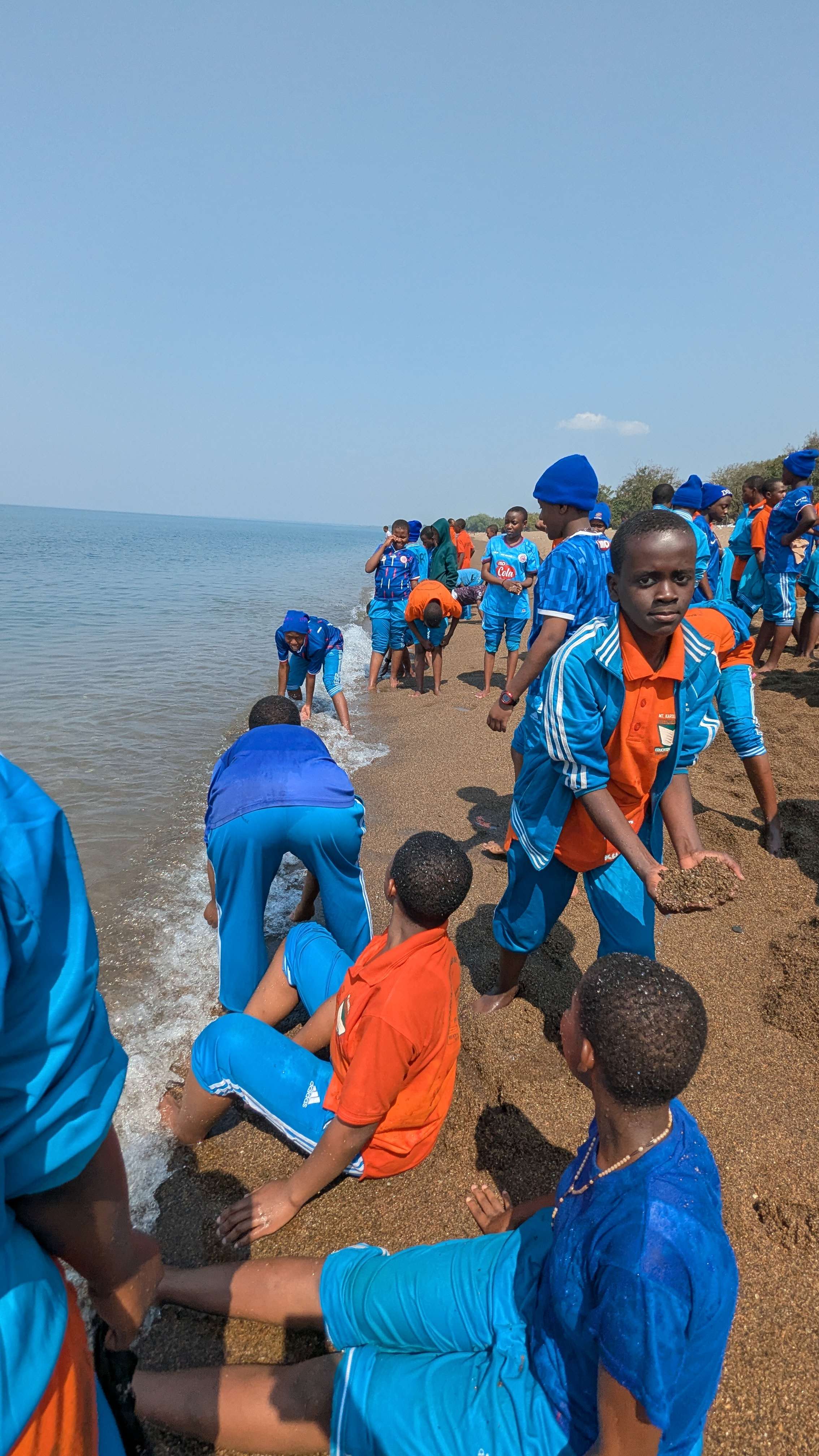 Students engaging in meaningful interactions at Lake Nyassa